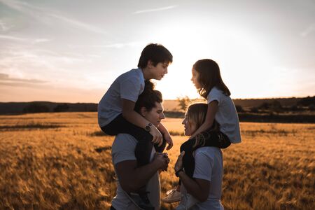 Portrait of a happy and fun family in the countryside. Concept of love familyの写真素材