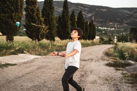 Kid playing spinning top.Concept of happy playing childrenの写真素材