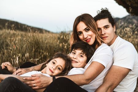 Portrait of a happy and funny young family outdoors.Family lifestyle conceptの写真素材