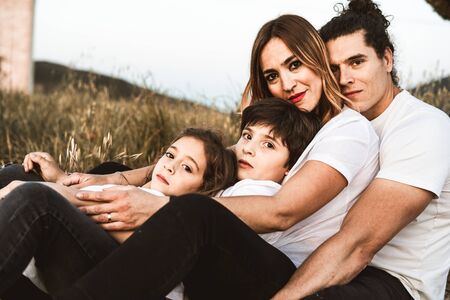 Portrait of a happy and funny young family outdoors.Family lifestyle conceptの写真素材
