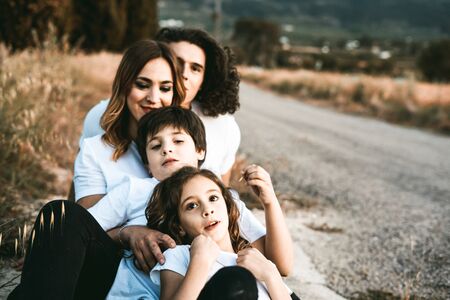 Portrait of a happy and funny young family outdoors.Family lifestyle conceptの写真素材
