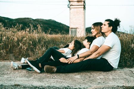 Portrait of a happy and funny young family outdoors.Family lifestyle conceptの写真素材