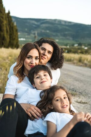Portrait of a happy and funny young family outdoors.Family lifestyle conceptの写真素材