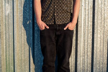 Portrait of a modern guy vintage casual dress with cap in the street. Photography style social networks. Young lifestyle conceptの写真素材