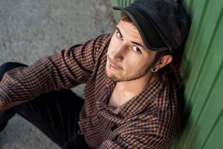Portrait of handsome young modern guy happy on the street. Guy casual dress. Concept social networksの写真素材