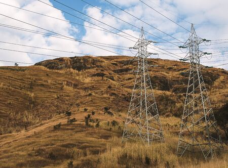Steel structure of Transmission line tower on blue sky.