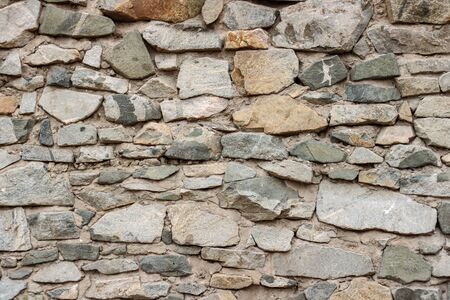 wild decorate stone wall texture. natural facade home dry background. old grunge rocks retro vintage...