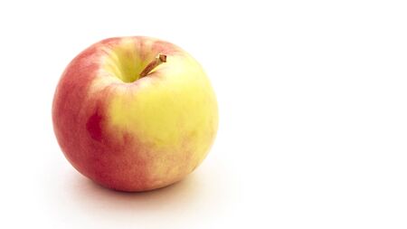 Bright and tasty red yellow apple isolated on a white background.の写真素材