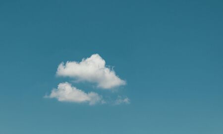 The vast blue sky background. White clouds on sky.の写真素材