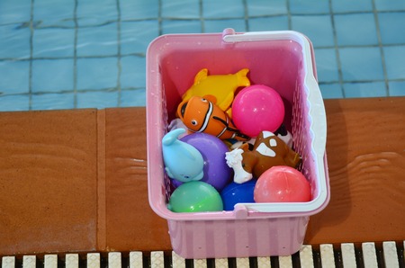 Water toy box beside swimming pool. Background texture. concept photo water, sport, swimming.の写真素材