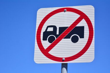 No heavy vehicles traffic sign	No heavy goods vehicles traffic sign and symbol against blue sky.の写真素材