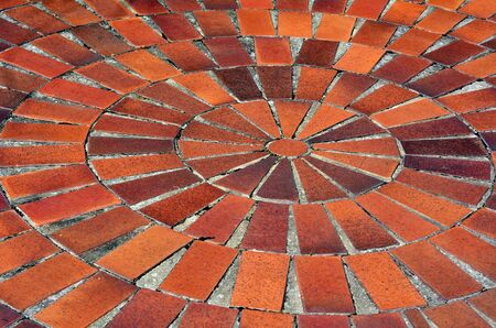 Red tile floor in spiral shape outdoor.