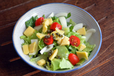 Fresh Green garden salad in a bawl.の写真素材