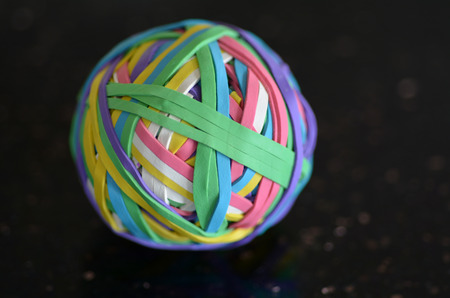 Rubber Band Ball on black surfers. の写真素材