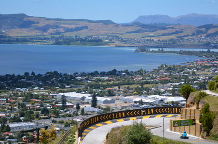 ROTORUA, NZL - JAN 18 2015:Visitors rides on Skyline Rotorua Luge.The famous Luge has 3 tracks of differing skill levels winding through the forest of Mount Ngongotaha in Rotorua city, New Zealand.のeditorial素材