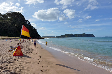 WHITIANGA, NZL - Jan 20 2015:Visitors in Hot Water beach.it one of the most popular geothermal attractions in New Zealand, about 700,000 people visit the beach annually.のeditorial素材