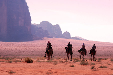 WADI RUM, JOR - NOV 10 2007: Camel riding in Wadi Rum,Jordan.It's one of Jordans important travel destinations among the massive and special rock formations.のeditorial素材