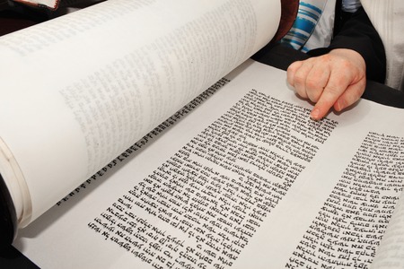 Boy reads the Torah for his Bar Mitzvah at the Wailing Wall in Jerusalem Israelの写真素材