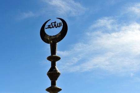 An Islamic crescent above a muslim mosque in  Jerusalem old city, Israel.の写真素材