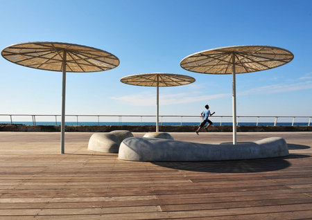 Boy runs at the old Tel Aviv Port Area in Tel Aviv, Israel.のeditorial素材