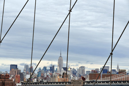 View of Manhattan NY skyline from Brooklyn Bridge in Manhattan New York, USA.のeditorial素材