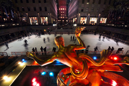 People ice skate at the famous ice arena of Rockefeller Center during winter time in Manhattan New York USAのeditorial素材