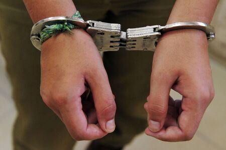 Image of a man arrested in a court room