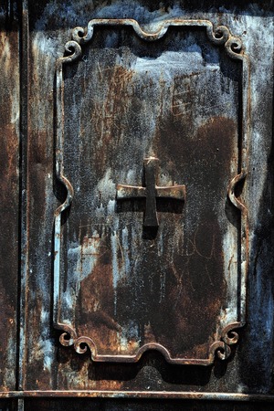 Close up details of a cross on a rusty door in the Church of Transfiguration in Mount Tabor in Lower Galilee, Israelの写真素材
