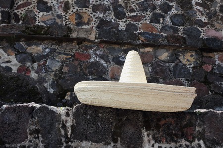 Sombrero hat lies on an ancient wall in Teotihuacan Pyramid of the Sun Mexican archaeological site in Mexico.の写真素材