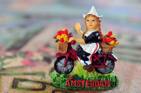 typical dutch souvenir of a Dutch girl on a table of a cafe / restaurant the city Amsterdam, Netherlands.の写真素材