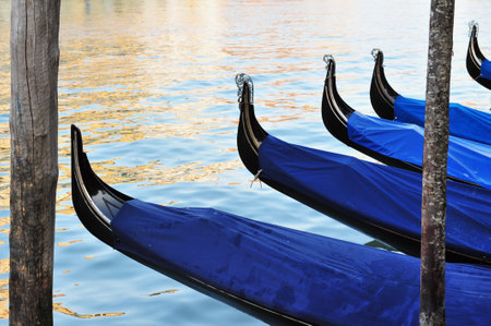 Gondolas mooring in the Grand Canal in Venice, Italy.のeditorial素材