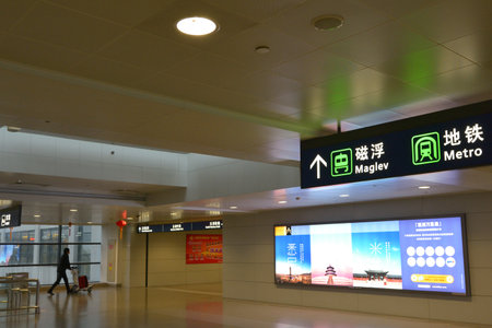 SHANGHAI, CN - MAR 15 2015:Passenger on the way to Shanghai Maglev Train. The line is the first commercially operated high-speed magnetic levitation line in the worldのeditorial素材