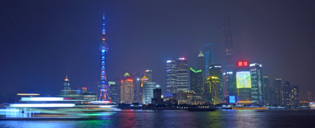 SHANGHAI, CN - MAR 15 2015:Pudong New Area skyline in Shanghai, China at night.It's home to the...