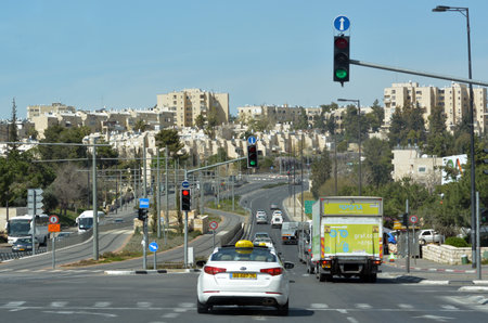 JERUSALEM, ISR - MAR 26 2015:Traffic on Number 01 road in Jerusalem, Israel.It used to be the border and ceasefire line that went through Jerusalem between Israel and Jordan from 1949 till 1967 war.のeditorial素材