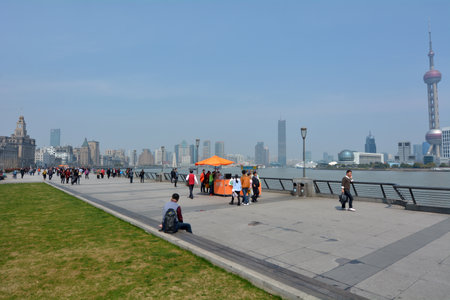 SHANGHAI, CN - MAR 17 2015:Visitors on Shanghai - The Bund or Waitan.Shanghai Bund has dozens of historical buildings and It is one of the most famous tourist destinations in Shanghai.のeditorial素材