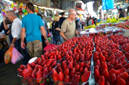 TEL AVIV, ISR - MAR 27 2015:Shoppers at Carmel Market Shuk HaCarmel in Tel Aviv, Israel.It's a very popular marketplace in Tel Aviv sells mostly food and home accessories goods.のeditorial素材