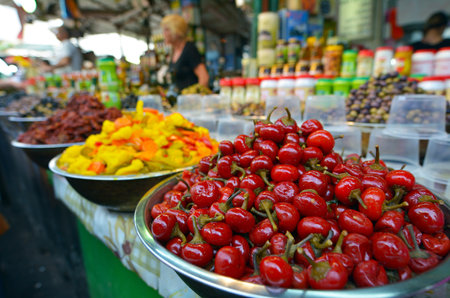 TEL AVIV, ISR - MAR 27 2015:Shoppers at Carmel Market Shuk HaCarmel in Tel Aviv, Israel.It's a very popular marketplace in Tel Aviv sells mostly food and home accessories goods.のeditorial素材