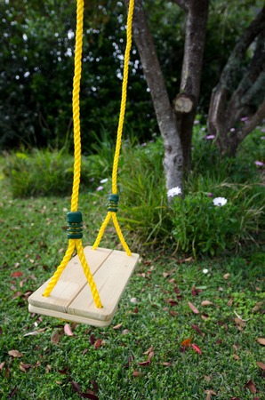 Empty swing in a home garden.の写真素材