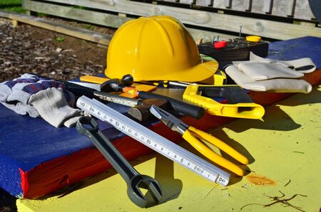 Builders hard hat with tools.の写真素材