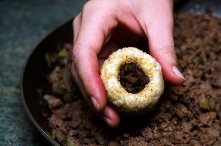 Chef hands prepares Middle Eastern cuisinen, Kubbeh matfuniya (Arabic word kubbah means "ball")  cooking.の写真素材