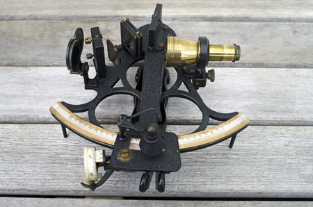 Sextant an old navigation instrument primary used to determine the angle between a celestial object and the horizon at sea.の写真素材