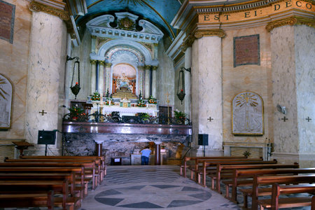 HAIFA, ISR - MAR 21 2015:Man pray at Stella Maris Church in Haifa, Israel.Monastery of Our Lady of Mount Carmel in Haifa is a 19th-century Discalced Carmelite monastery located on Mount Carmel, Israelのeditorial素材