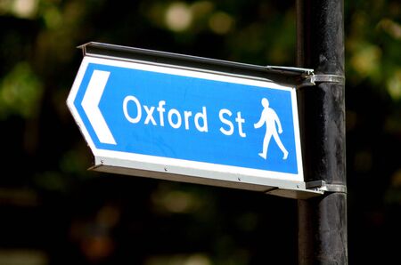 Arrow sign show pedestrians the way to Oxford street the most famous famous shopping street in London England and the United Kingdom.の写真素材