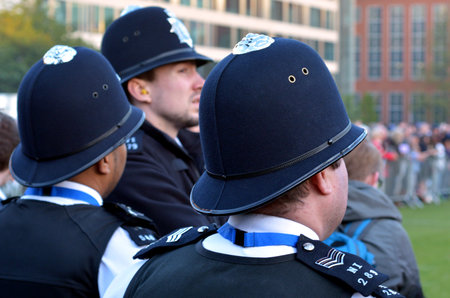 LONDON - MAY 12 2015:Metropolitan Police Service officers on guard duty.Since Jan 2015 Police across...