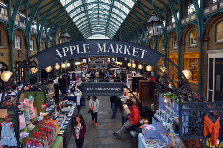 LONDON - MAY 15 2015:Visitors in Apple Market in Covent Garden in London, UK. The Apple Market is sells arts and crafts dedicated to antiques and collectables items.のeditorial素材