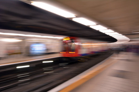 LONDON, UK - MAY 12 2015:Motion blur of London Underground train.The average scheduled train speed (including stops) is 33 km/h.のeditorial素材