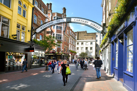 LONDON - MAY 14 2015:Visitors at Carnaby Street London UK.Carnaby Street is a popular pedestrianised shopping street in the City of Westminster, Londonのeditorial素材