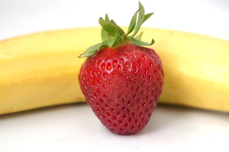 One Strawberry and banana isolated on a white background.の写真素材