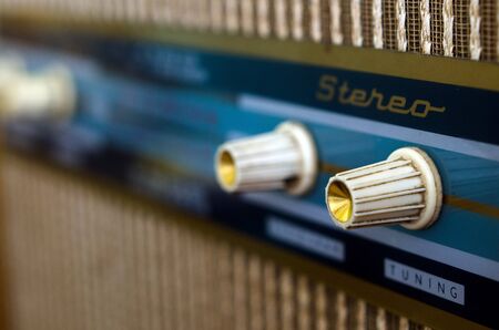 Close up of a worn antique radio.の写真素材