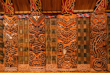 Traditional Maori Wood Carvings in Meeting House .の写真素材